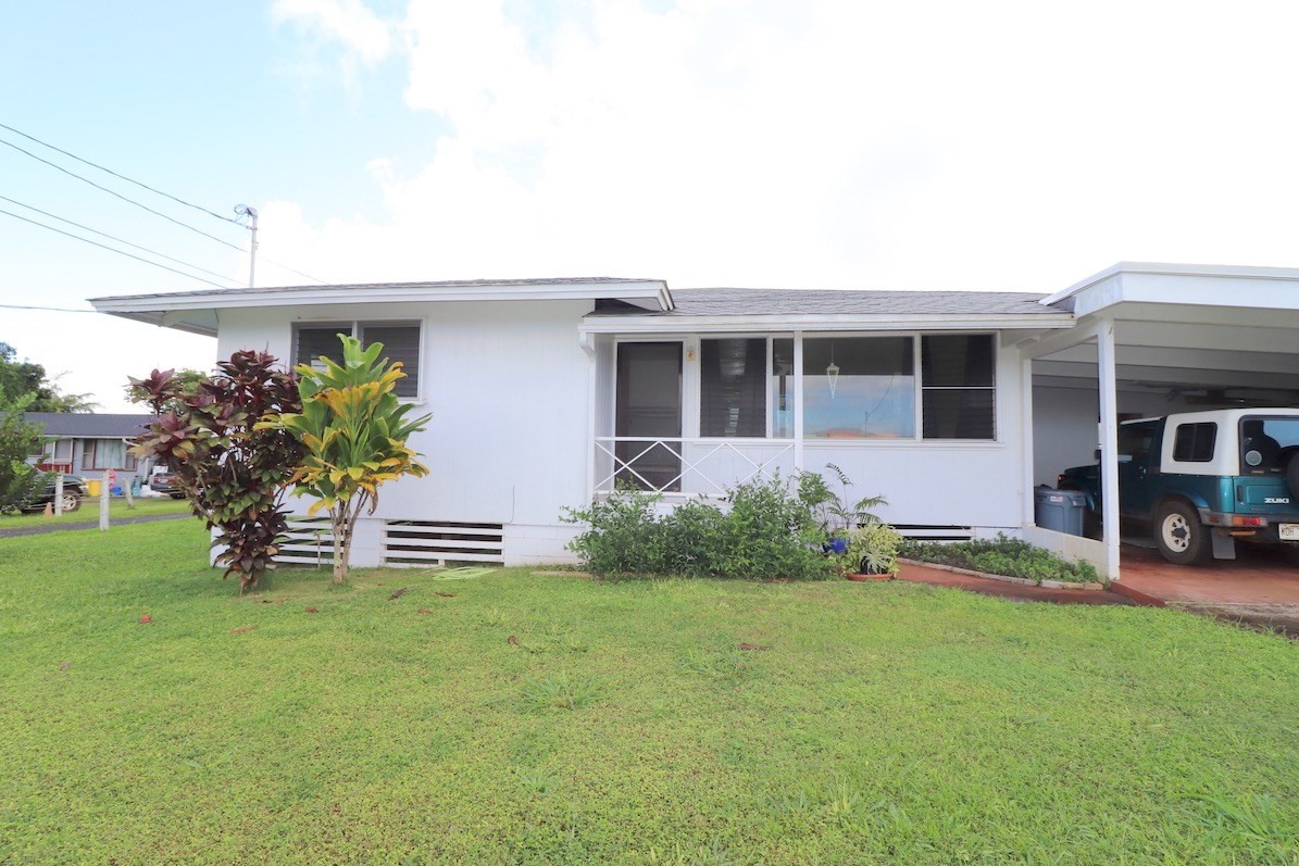 3434 Hailima Road Koloa, HI 96756 - Photo 1 of 13 a front view of house with yard and green space