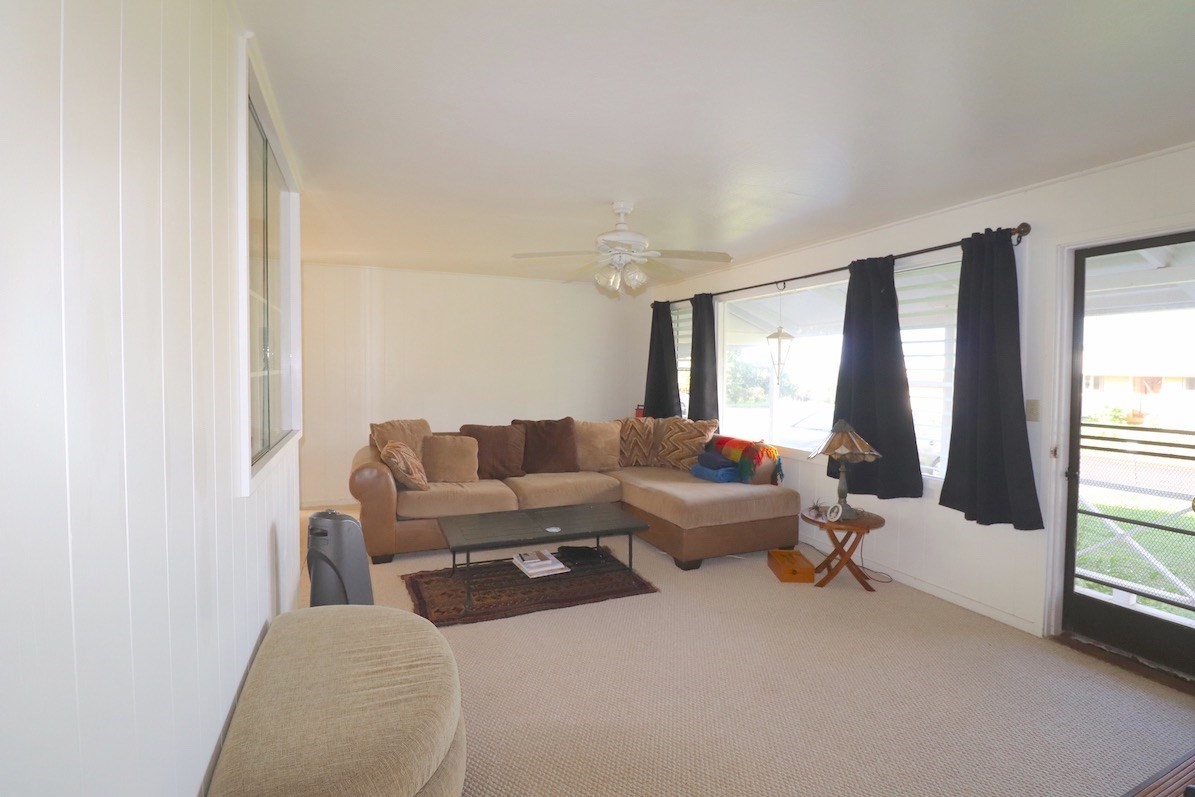 3434 Hailima Road Koloa, HI 96756 - Photo 2 of 13 a living room with furniture and a large window