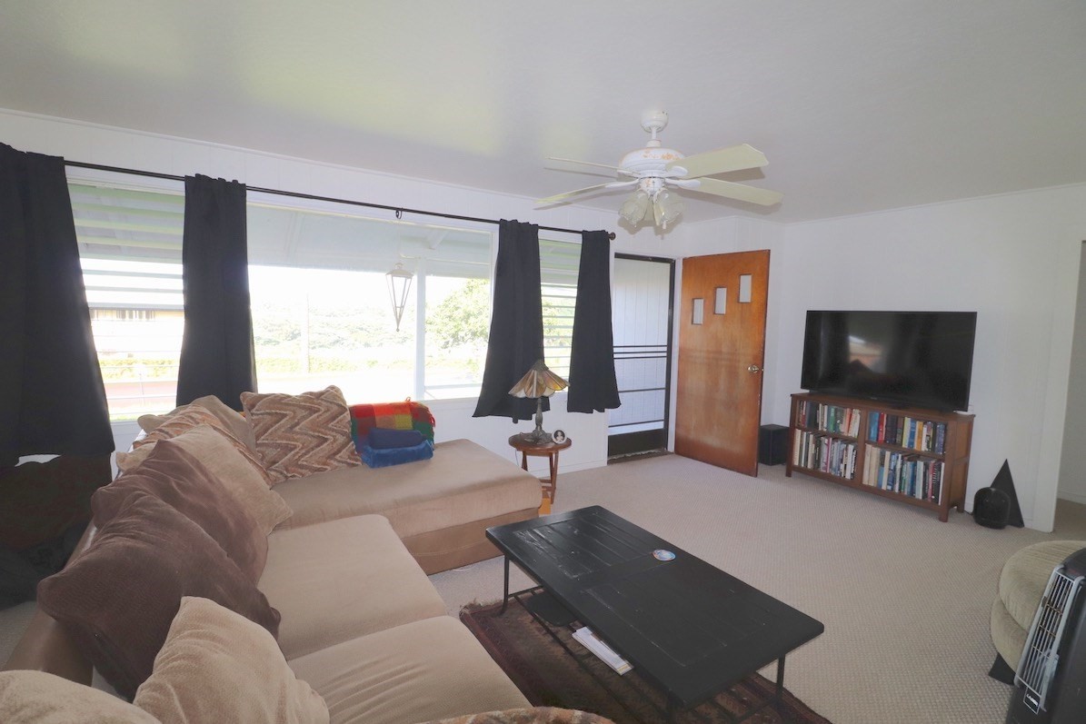 3434 Hailima Road Koloa, HI 96756 - Photo 3 of 13 a living room with furniture and a flat screen tv