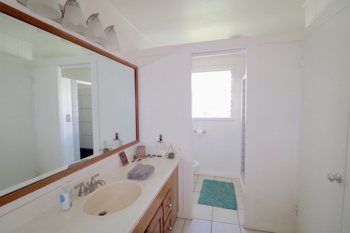 3434 Hailima Road Koloa, HI 96756 - Photo 9 of 13 a bathroom with a sink and a mirror