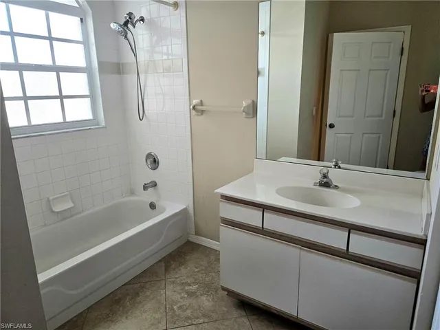 a bathroom with a sink and a bathtub