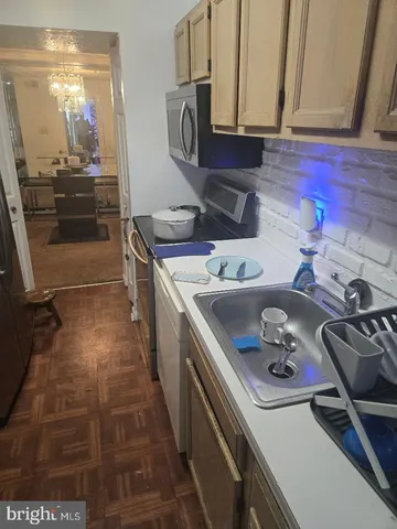 a kitchen with a sink and cabinets