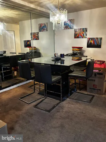 a kitchen with a table and chairs in it