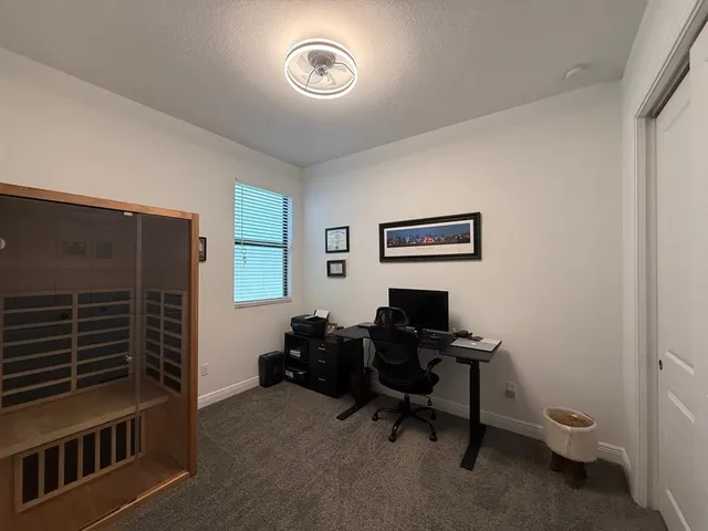 a bathroom with a sink a toilet and a large mirror