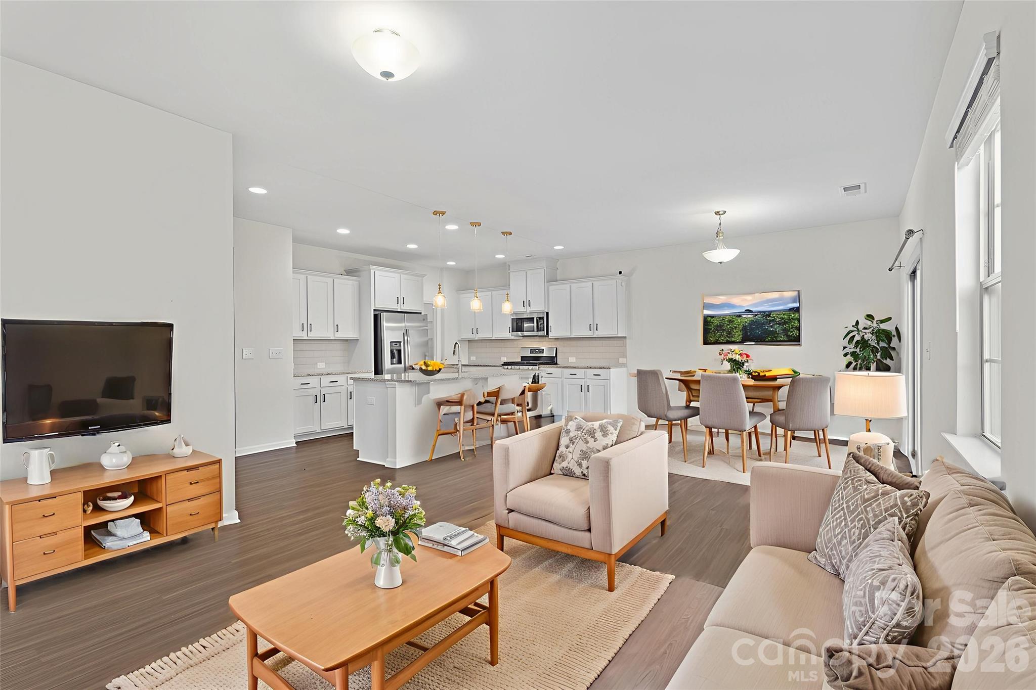 620 Amber Meadows Way Tega Cay, SC 29708 - Photo 12 of 27 a living room with furniture and a flat screen tv