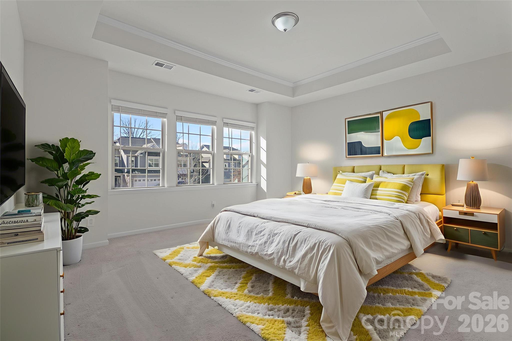 620 Amber Meadows Way Tega Cay, SC 29708 - Photo 13 of 27 a bedroom with a bed and a potted plant