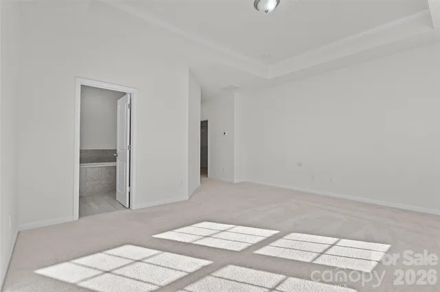 a view of a bedroom with a bed and closet