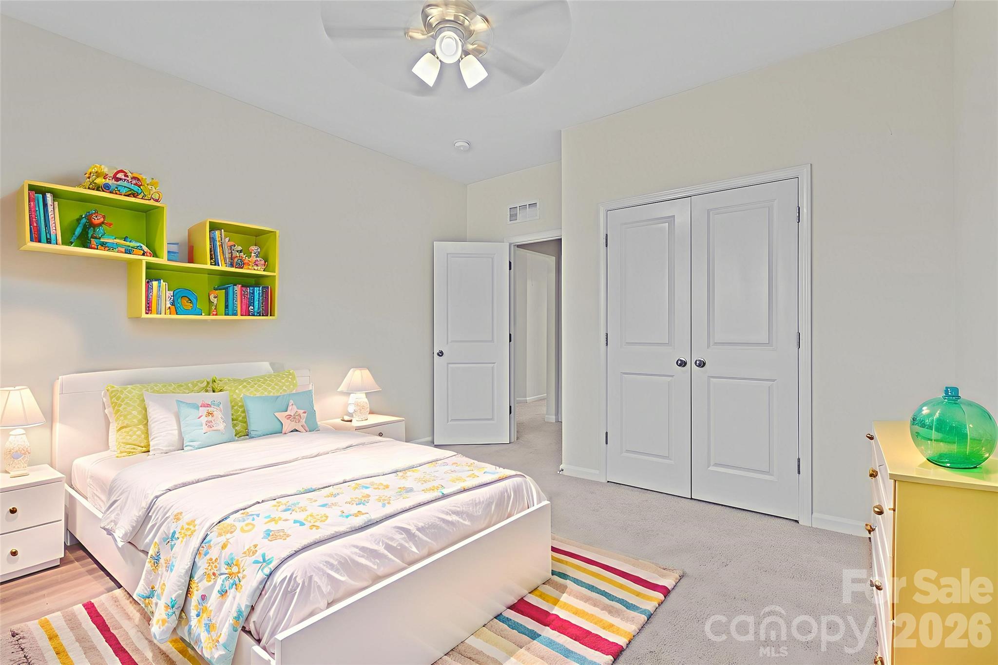 620 Amber Meadows Way Tega Cay, SC 29708 - Photo 21 of 27 a bedroom with a bed and a chandelier
