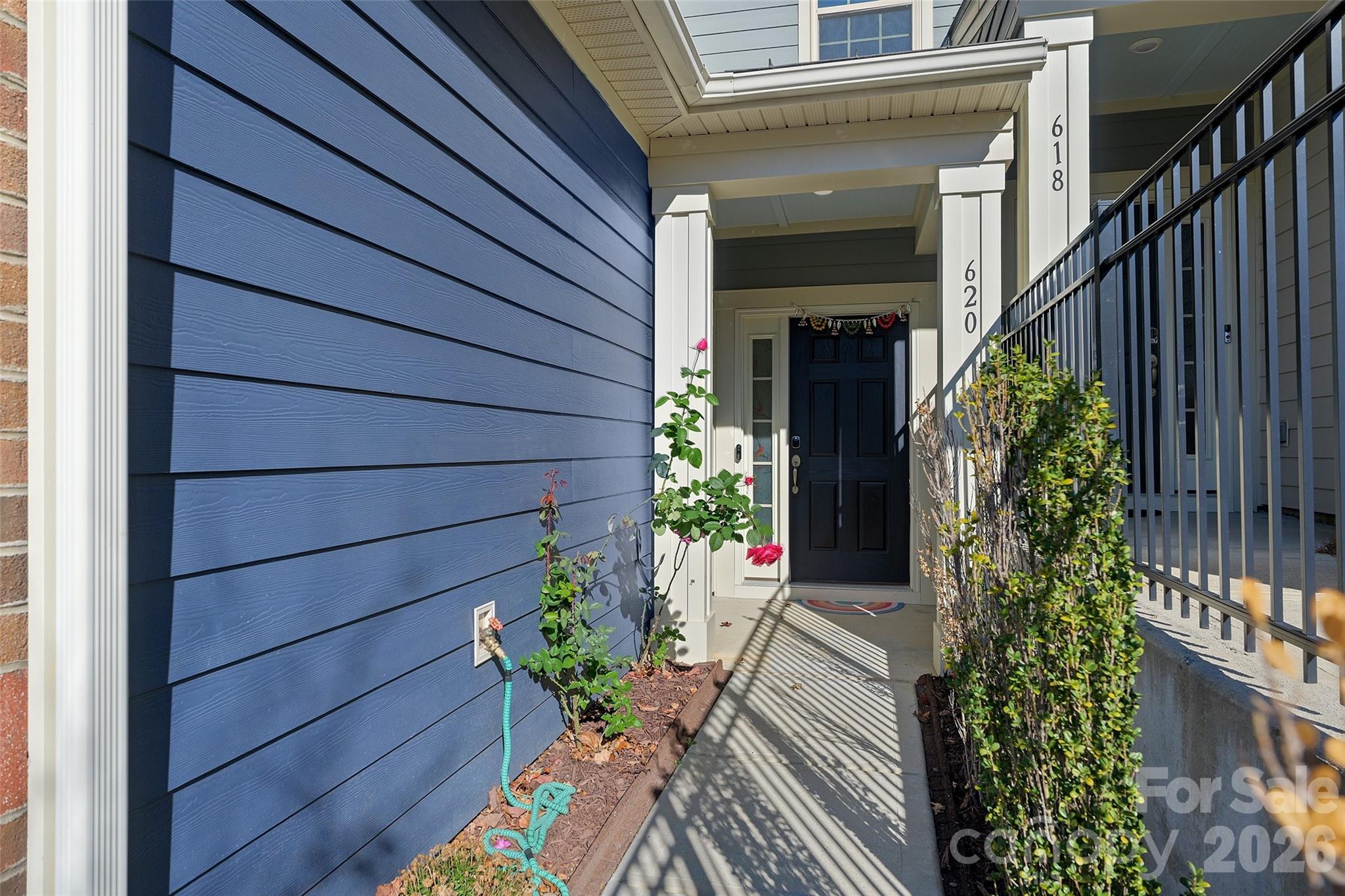 620 Amber Meadows Way Tega Cay, SC 29708 - Photo 3 of 27 a vase with flowers sitting on a wooden floor