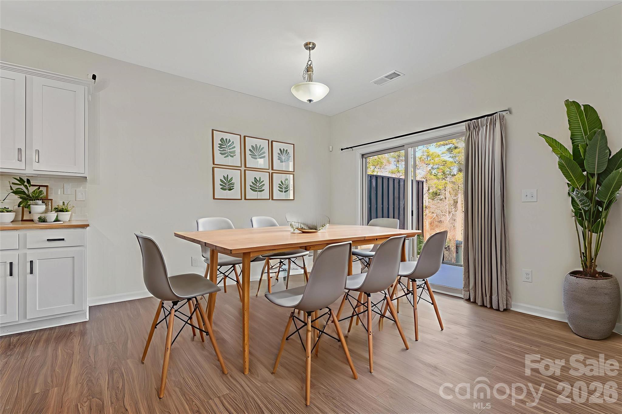 620 Amber Meadows Way Tega Cay, SC 29708 - Photo 10 of 27 a view of a dining room with furniture window and wooden floor