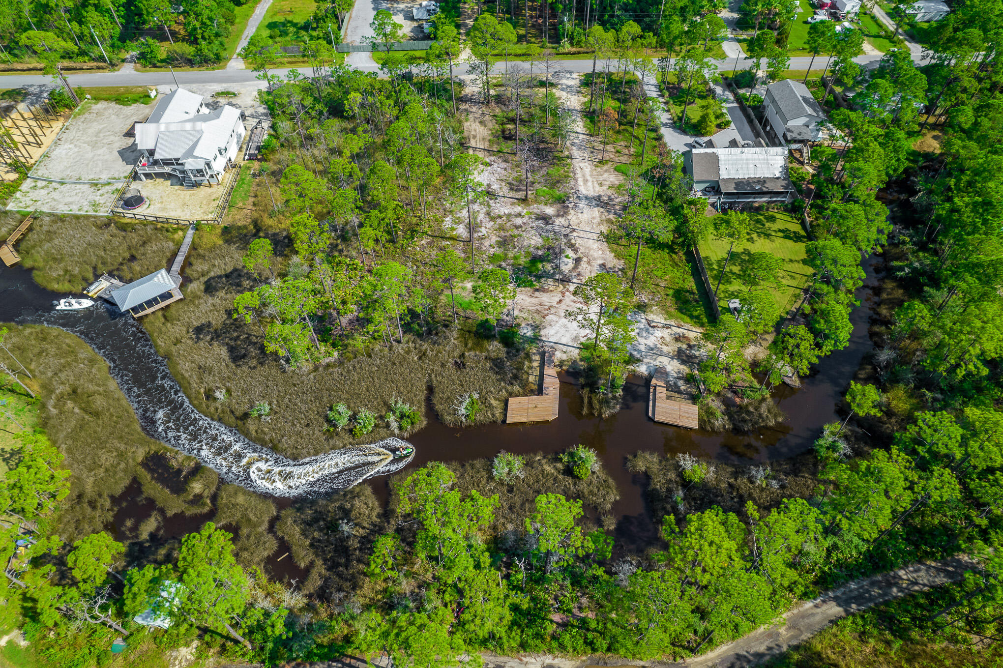 Lot 9 West Nursery Road Santa Rosa Beach, FL 32459 - Photo 5 of 11 an aerial view of a house with a yard and lake view