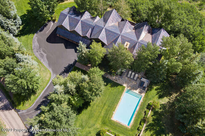 650 Pioneer Springs Ranch Road Aspen, CO 81611 - Photo 5 of 30 an aerial view of a house with garden space and street view