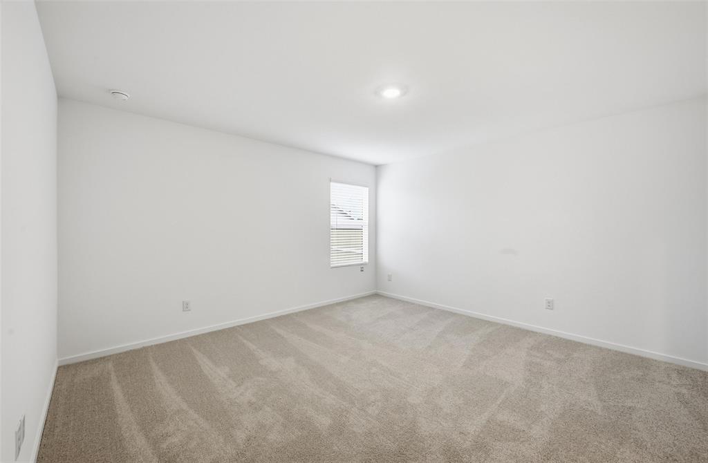 1034 Raintree Road Princeton, TX 75407 - Photo 11 of 21 a view of an empty room and window