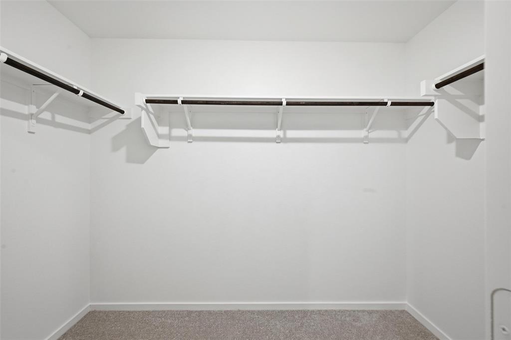 1034 Raintree Road Princeton, TX 75407 - Photo 13 of 21 a view of an empty walk in closet