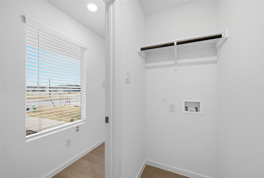1034 Raintree Road Princeton, TX 75407 - Photo 17 of 21 a view of a small space with wooden floor and a window