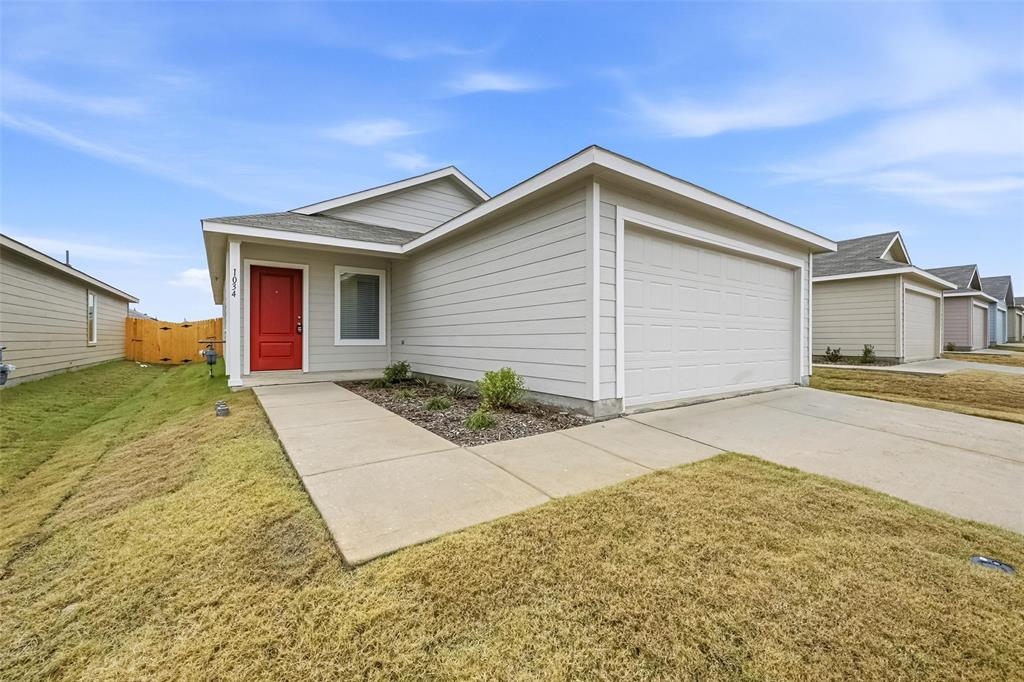 1034 Raintree Road Princeton, TX 75407 - Photo 20 of 21 a view of garage and yard