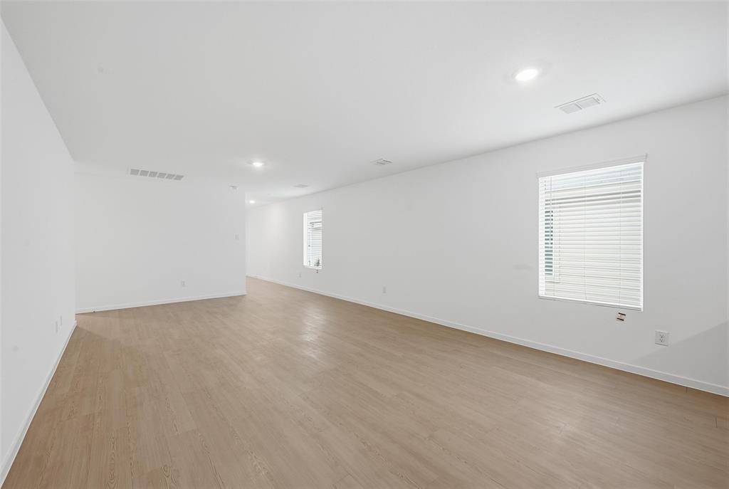 1034 Raintree Road Princeton, TX 75407 - Photo 8 of 21 an empty room with a empty space and a window