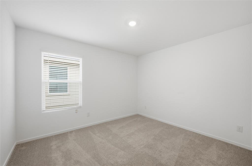 1034 Raintree Road Princeton, TX 75407 - Photo 9 of 21 an empty room with a window