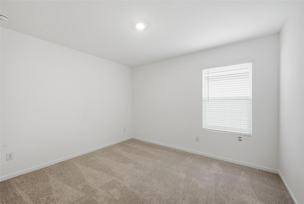 1034 Raintree Road Princeton, TX 75407 - Photo 10 of 21 an empty room with a window