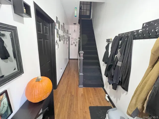 a view of a living room with wooden floor