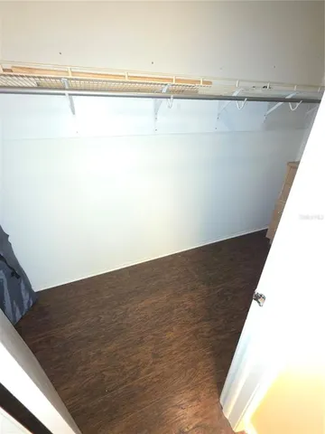 a view of a room with racks on the wall