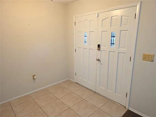 a view of a bathroom with white shower