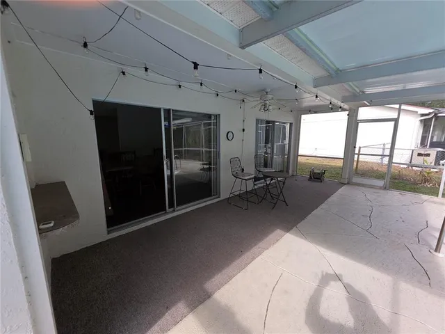 a view of a hallway with wooden shelves