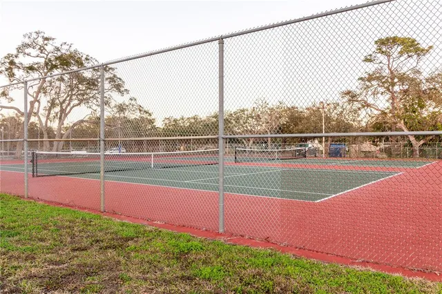 a front view of a house with a yard and a garage