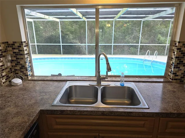 a bathroom with a sink and a window