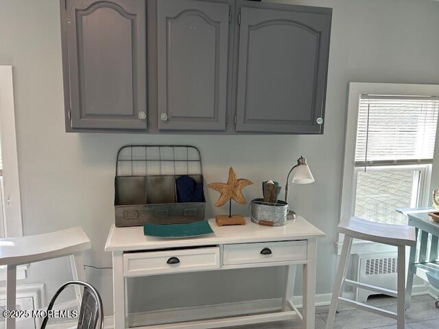 65 Mt Hermon Way, Unit 3 Ocean Grove, NJ 07756 - Photo 6 of 9 a kitchen with a stove and a white cabinets