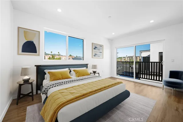 a bedroom with a bed and dresser