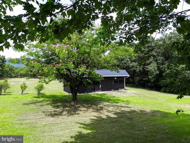 a view of a lake with a yard