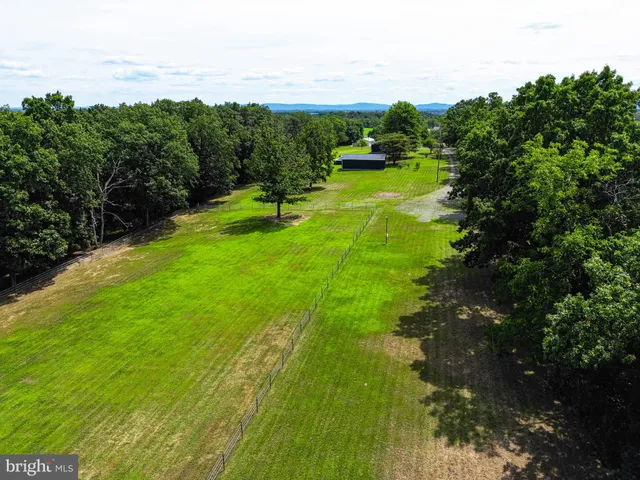 a balcony with furniture and wooden floor