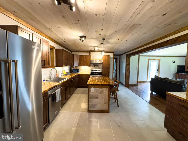 a bedroom with a bed and a mirror