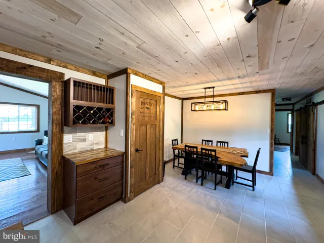 a bathroom with a tub sink and a mirror