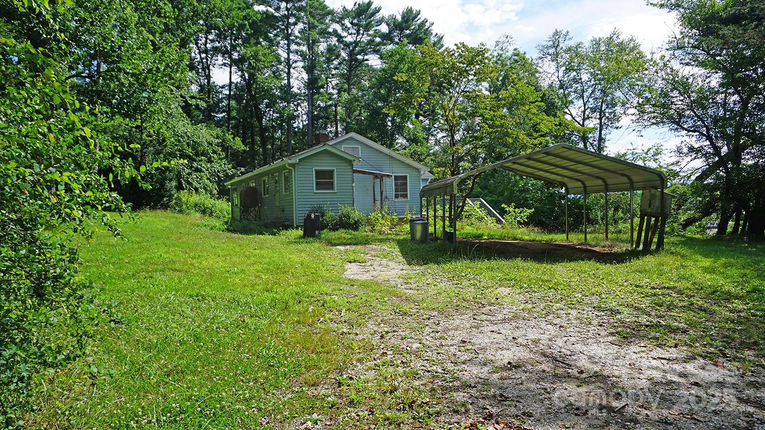 57 Sizer Drive Mills River, NC 28759 - Photo 15 of 16 a view of a house with yard and a garden