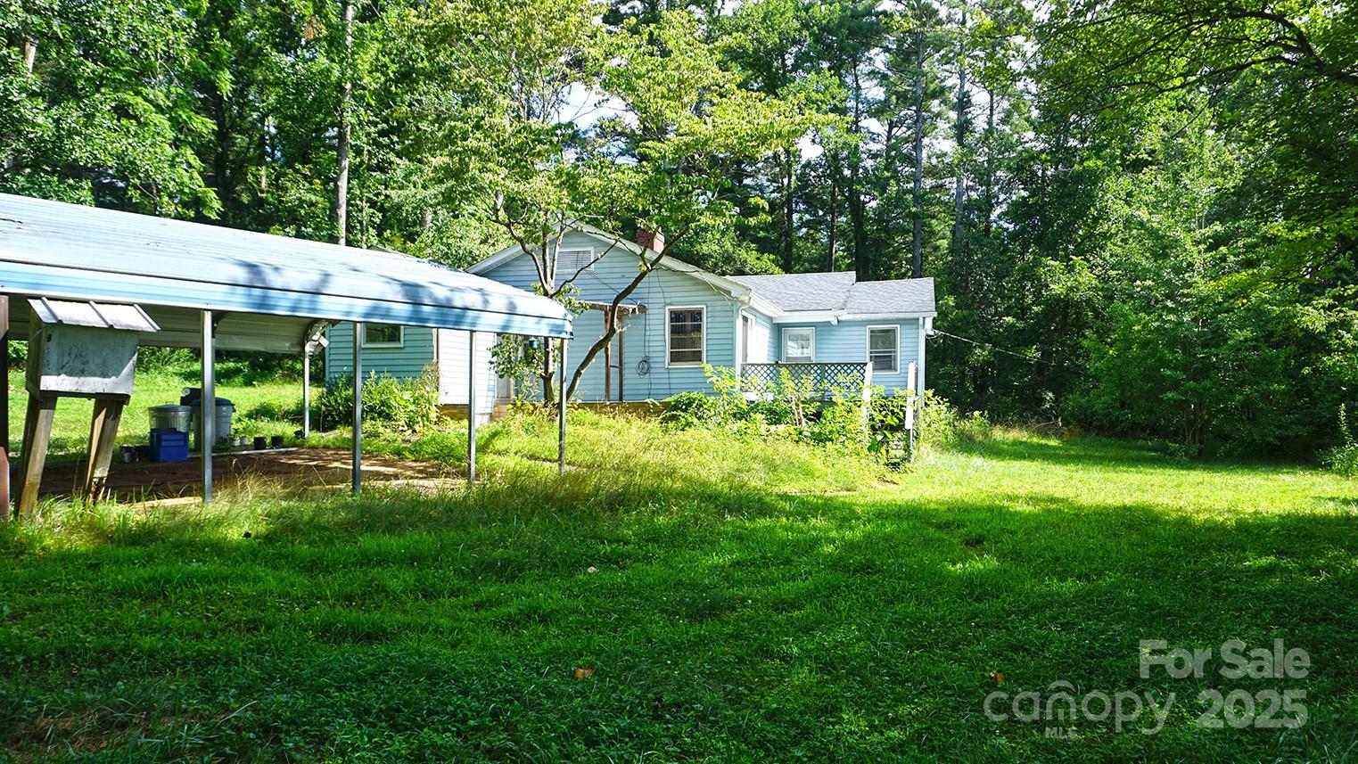 57 Sizer Drive Mills River, NC 28759 - Photo 5 of 16 a front view of a house with yard and green space