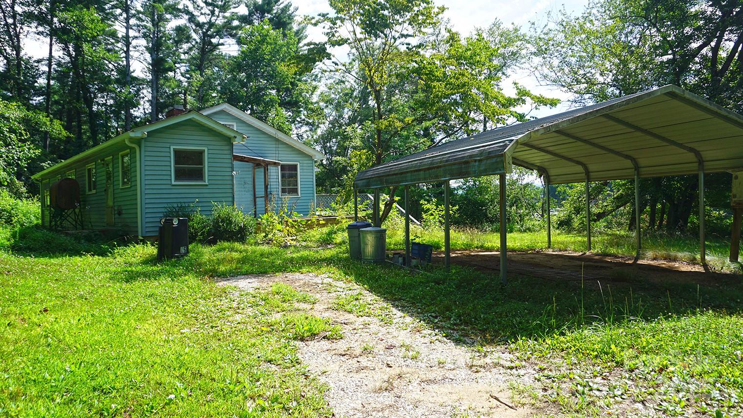 57 Sizer Drive Mills River, NC 28759 - Photo 10 of 16 a front view of a house with garden