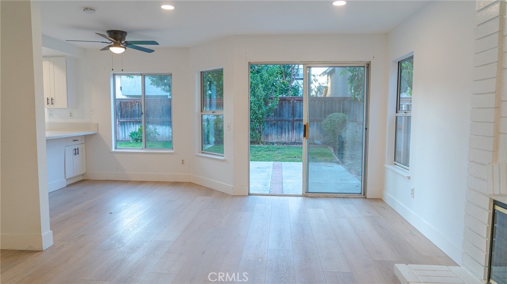 21 Fillmore Irvine, CA 92620 - Photo 11 of 36 an empty room with wooden floor and a floor to ceiling window