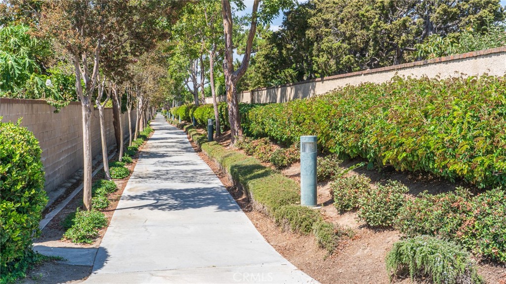21 Fillmore Irvine, CA 92620 - Photo 18 of 36 a front view of a house with a yard and fountain in middle