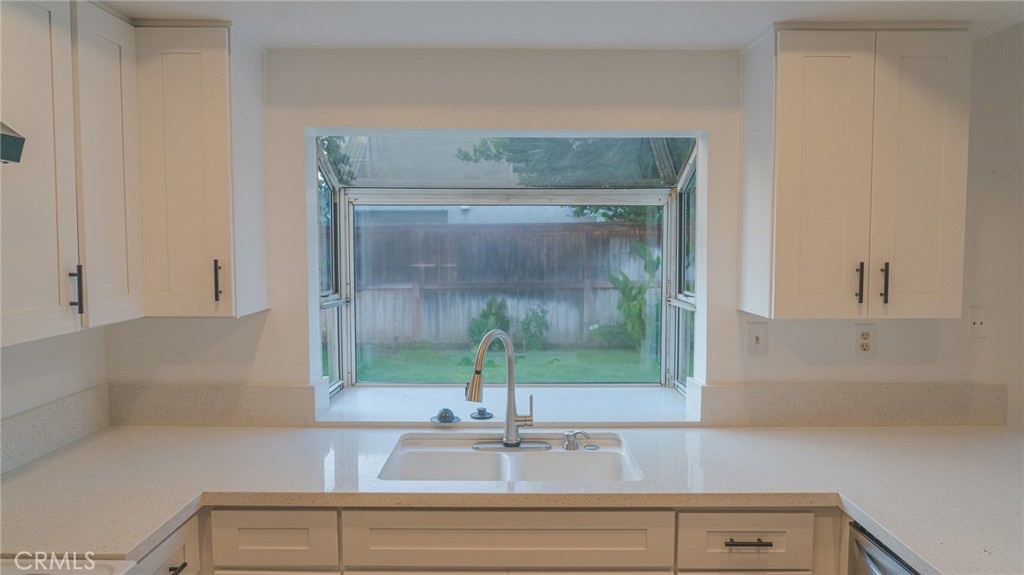21 Fillmore Irvine, CA 92620 - Photo 22 of 36 a bathroom with a sink and mirror