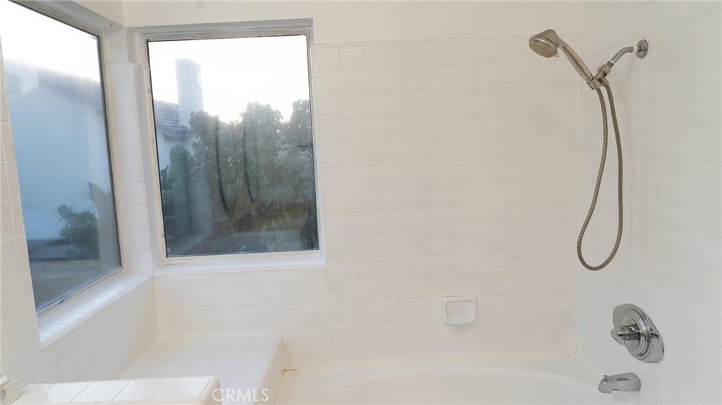 21 Fillmore Irvine, CA 92620 - Photo 32 of 36 a bathroom with a shower and a window