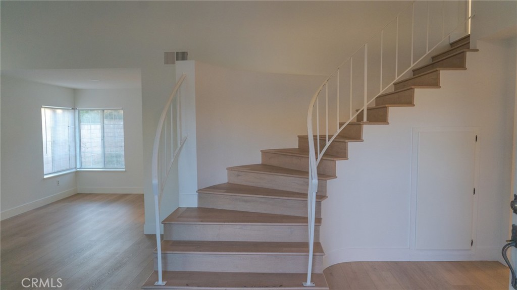 21 Fillmore Irvine, CA 92620 - Photo 4 of 36 a view of entryway and hall with wooden floor