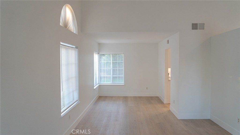 21 Fillmore Irvine, CA 92620 - Photo 5 of 36 an empty room with a empty space and windows