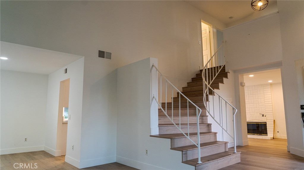 21 Fillmore Irvine, CA 92620 - Photo 9 of 36 a view of entryway and hall with wooden floor