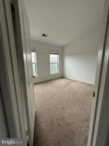 a view of entryway with window and stairs