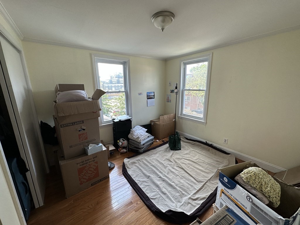 438 Washington Street, Unit 2 Boston, MA 02135 - Photo 8 of 12 a living room with furniture and a window