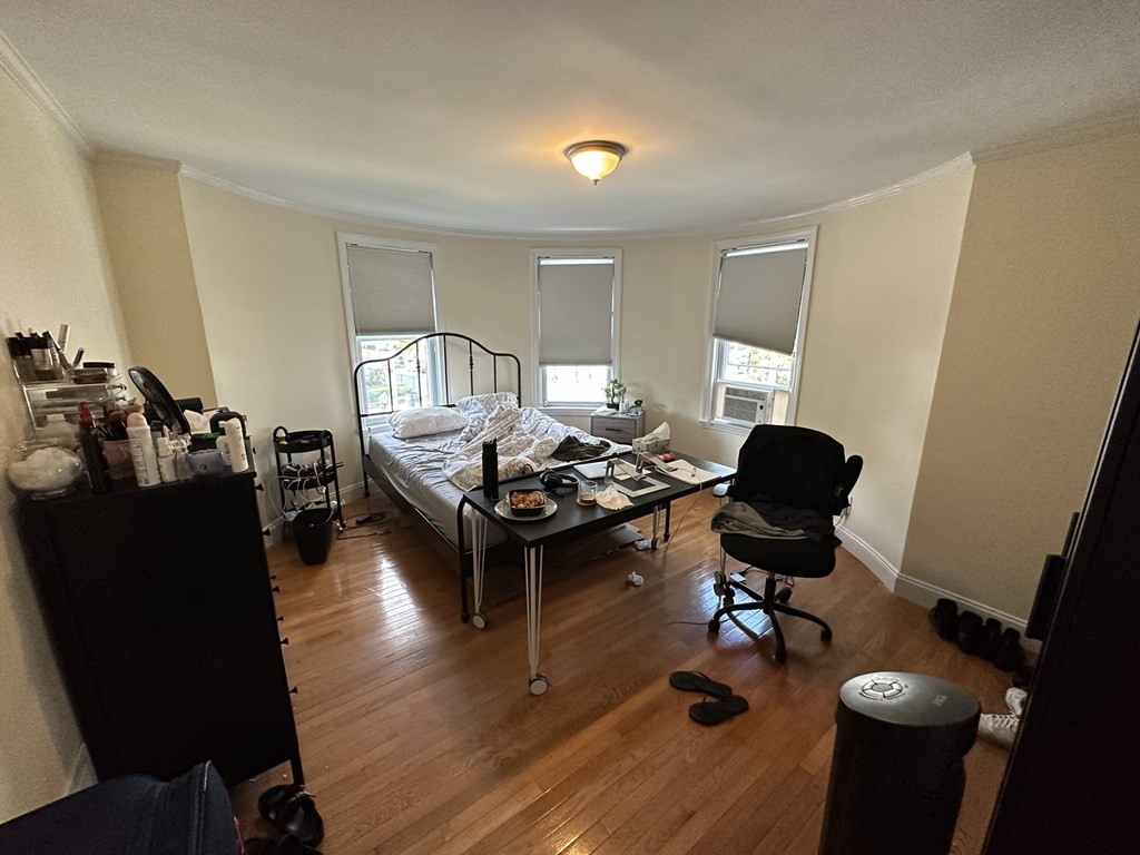 438 Washington Street, Unit 2 Boston, MA 02135 - Photo 10 of 12 a living room with furniture and wooden floor