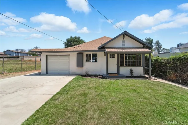 front view of a house with a yard