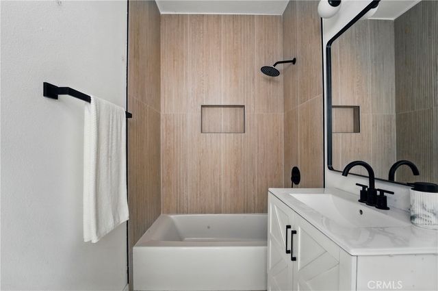 a bathroom with a sink and a bathtub